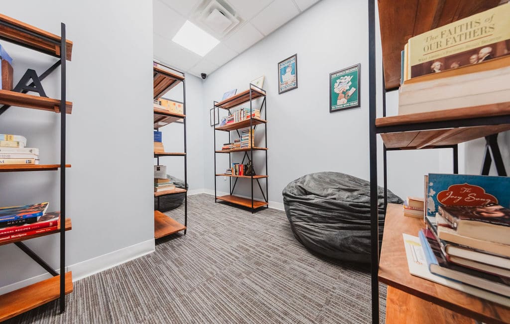 a room filled with shelves filled with books, representing a Mental Health Center Near New Jersey